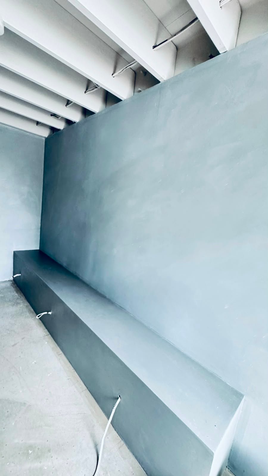 Micro cement feature wall and built-in bench seat